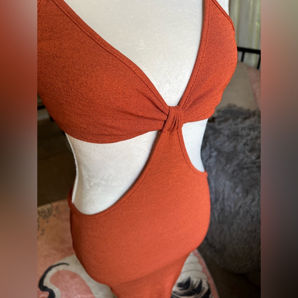 Summer dress size small it's more of a burnt orange color very attractive on